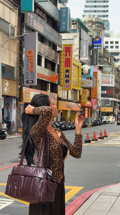 Instagram post by @aliyahwears for CALPAK. Caption reads: [...] sweet escape starts here 🍒 @calpak #ad....