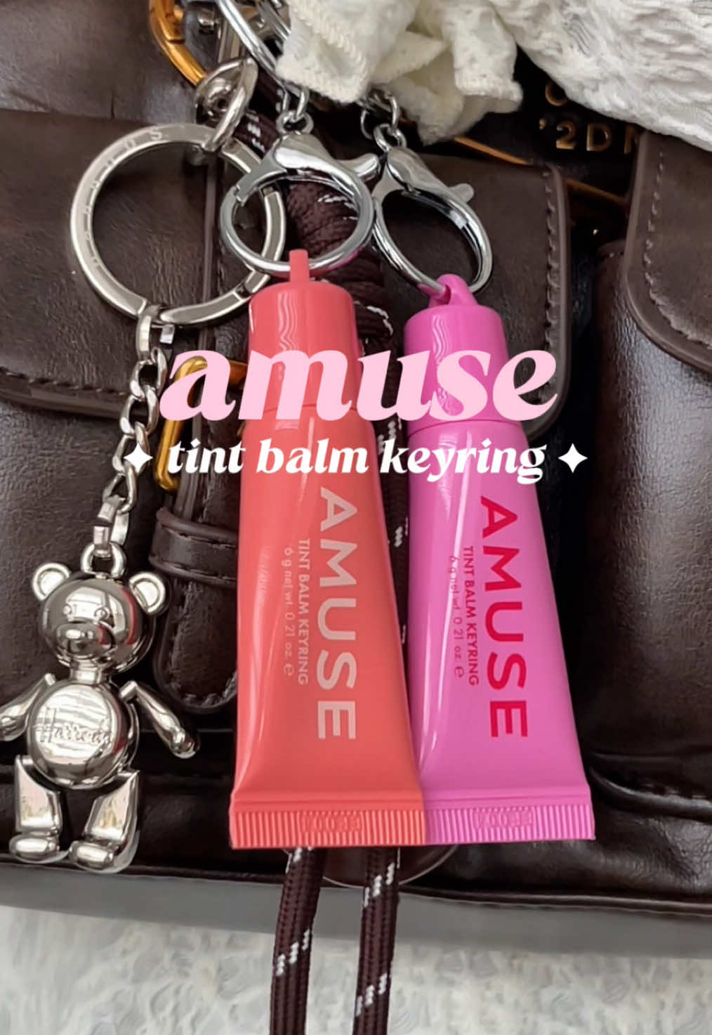 TikTok post by @h0neybuttercups for AMUSE Seoul. Caption reads: @AMUSE Seoul tinted lip balm that double up as....