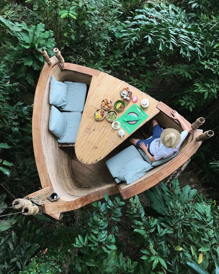 Instagram post by @travelingwithstyle_ for Small Luxury Hotels. Caption reads: Surrounded by untamed jungle and pristine beaches....