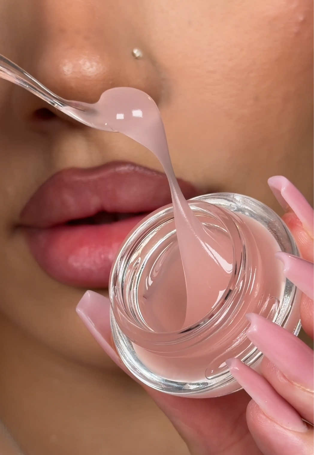 TikTok post by @hannahmsophia for Glow Is Here. Caption reads: the glossiest lip balm i’ve ever tried for glass....