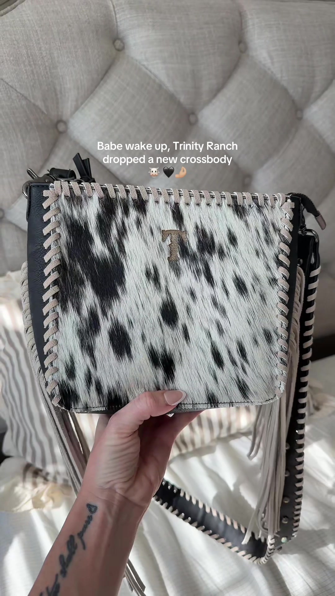 TikTok post by @cheyenne.wyoming for Vaqueras Outfitters. Caption reads: The cowhide and the fringe 🤩🤌🏼 @Vaqueras....