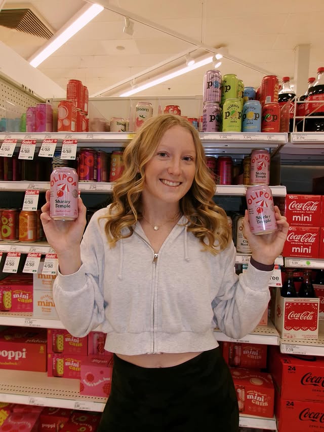 Instagram post by @maddiesibbing for 98Strong. Caption reads: [...] 🥤 #olipoppartner @drinkolipop @98strong_.