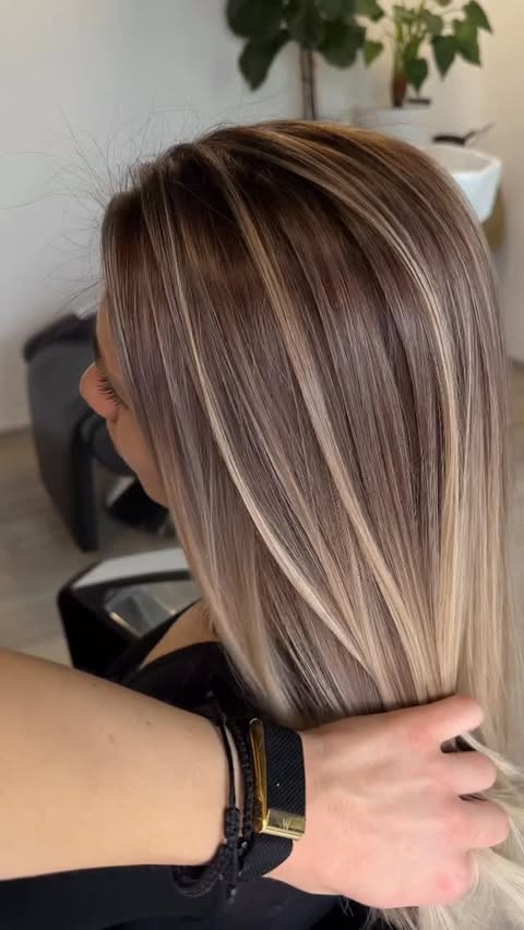 Instagram post by @hair_by_oana for Moroccanoil. Caption reads: [...] I worked with: ✨ Moroccanoil Blonde Voyage....