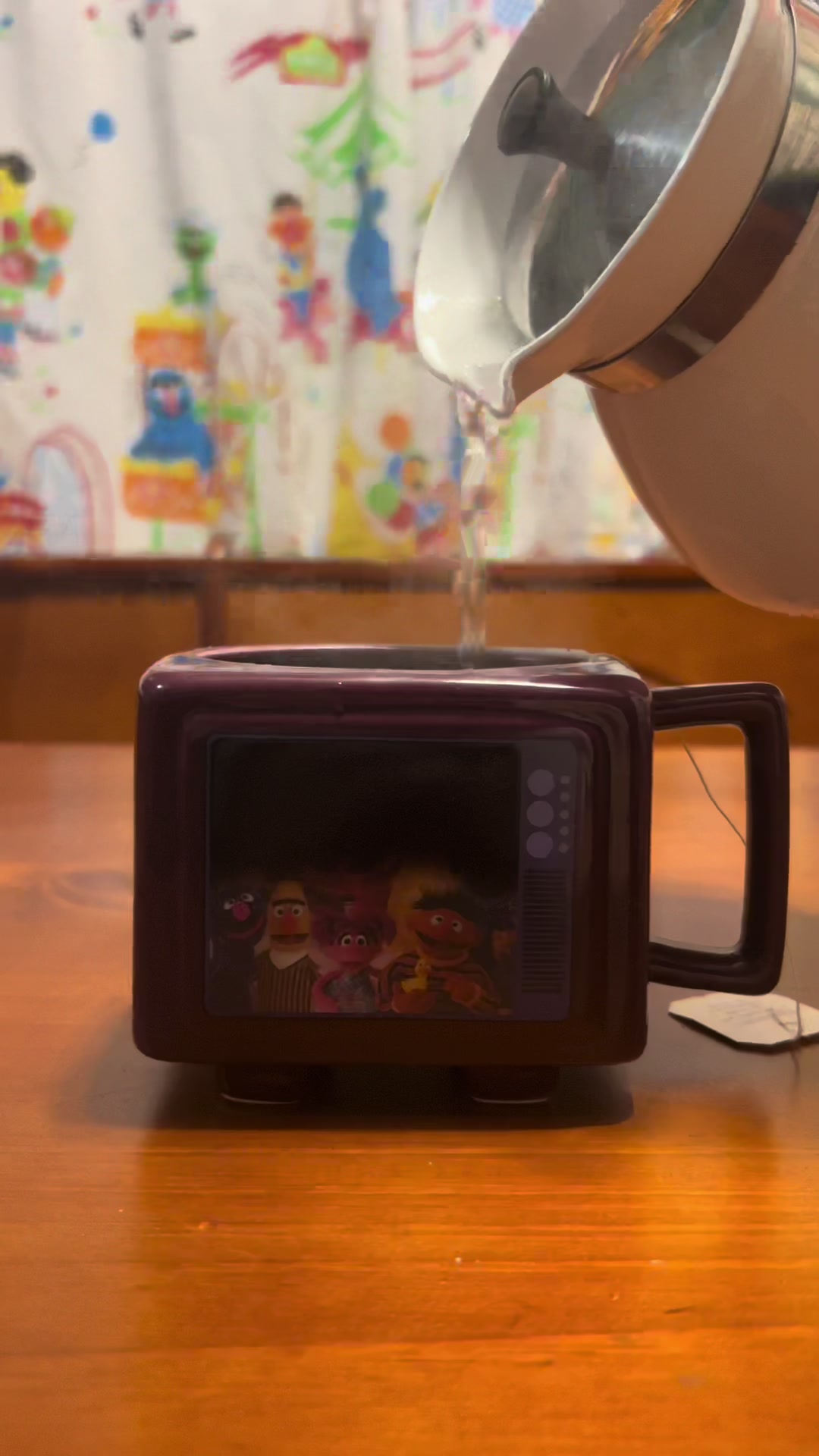 TikTok post by @muppetmarissa for FUN.com. Caption reads: got a new Sesame Street mug from @fundotcom 📺....