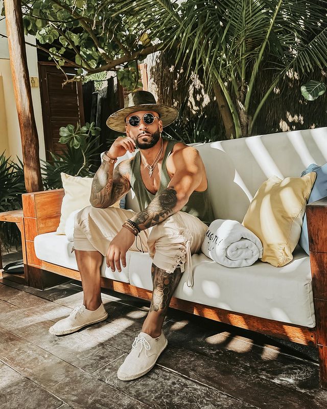 Instagram post by @camerron.james for Men's Fashion & Style. Caption reads: Living my best life on the stunning beaches of....