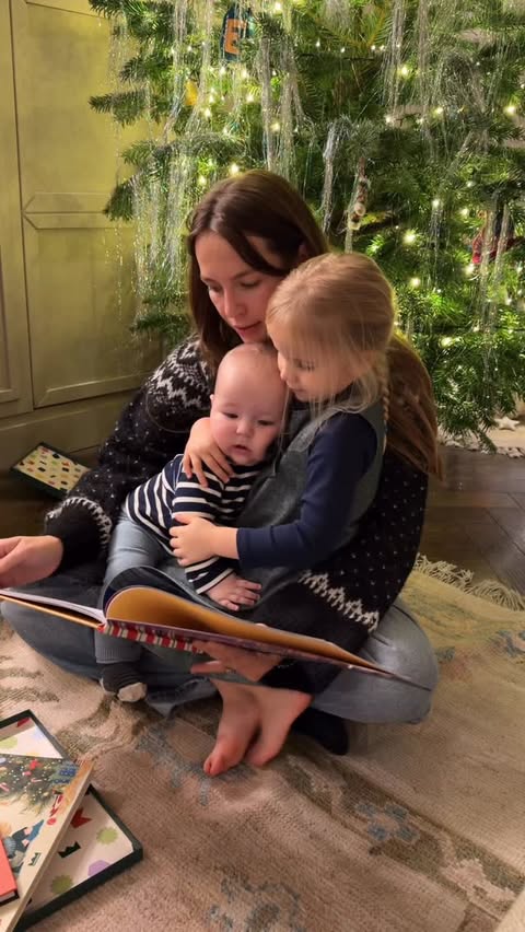 Instagram post by @emmalouiseconnolly for Wonderbly. Caption reads: New Christmas traditions with our two babies....