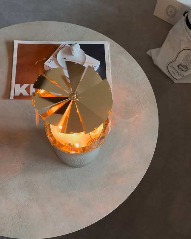 Instagram post by @sara.takanashi for Diptyque. Caption reads: a night of wax and gold🕯️💫

@diptyque 
#pr....