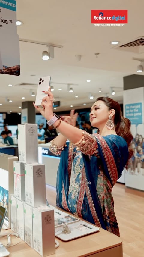 Instagram post by @myself_koushani for Reliance Digital. Caption reads: Unveiling the OPPO Reno 15 Pro Mini, where compact....