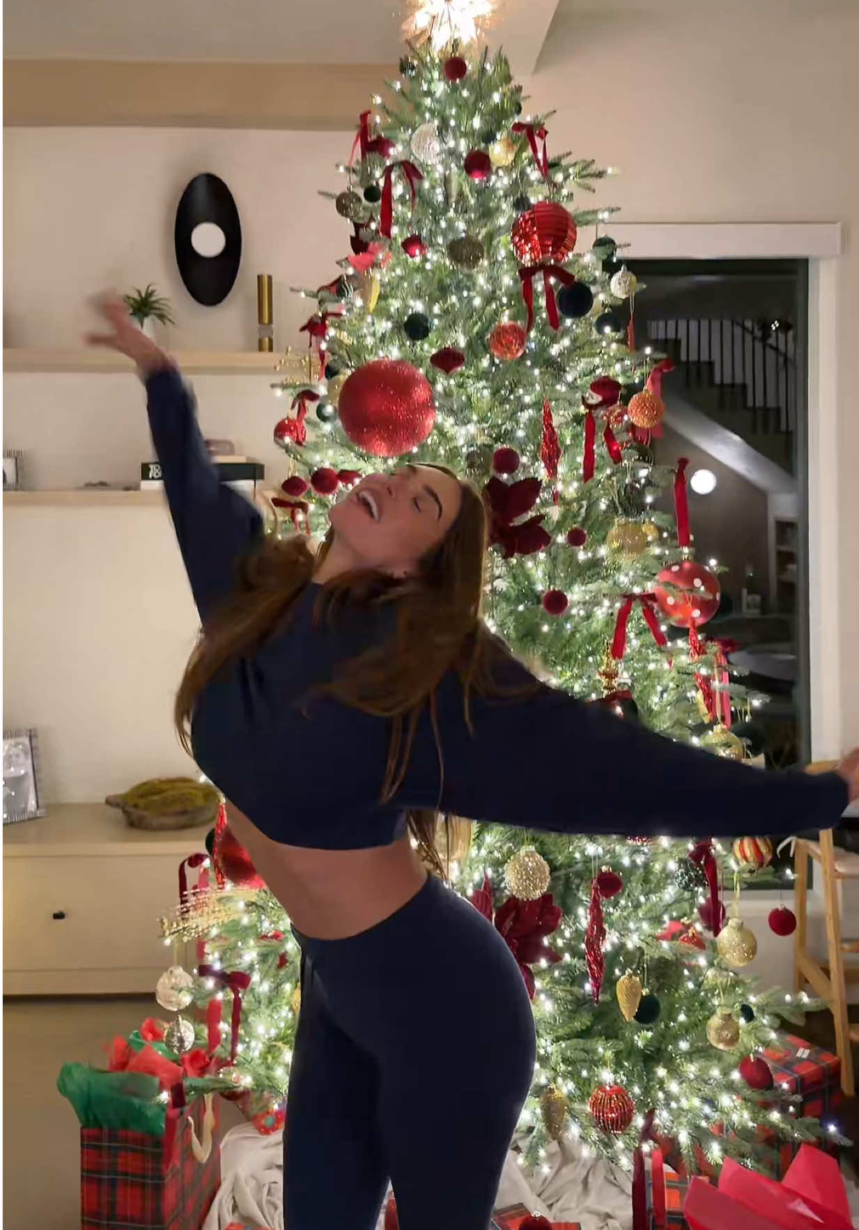 TikTok post by @stassiebaby for Alo Yoga. Caption reads: merry christmas eve 🎄🎁 @alo .