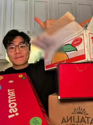 TikTok post by @thatbigbackkyle for Momofuku. Caption reads: [...] #prboxes @Eat Tantos @Catalina Crunch....
