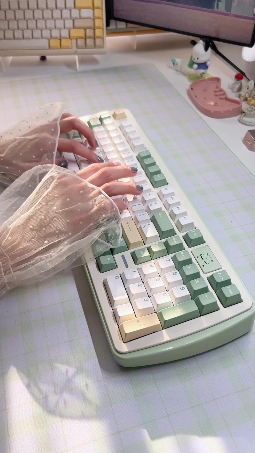 TikTok post by @mango.keebs for Unikeyboards. Caption reads: (ad) my new favorite (almost) full sized board 💚....