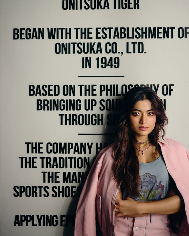 Instagram post by @rashmika_mandanna for Onitsuka Tiger. Caption reads: Stepped into the new @onitsukatigerindia space at....