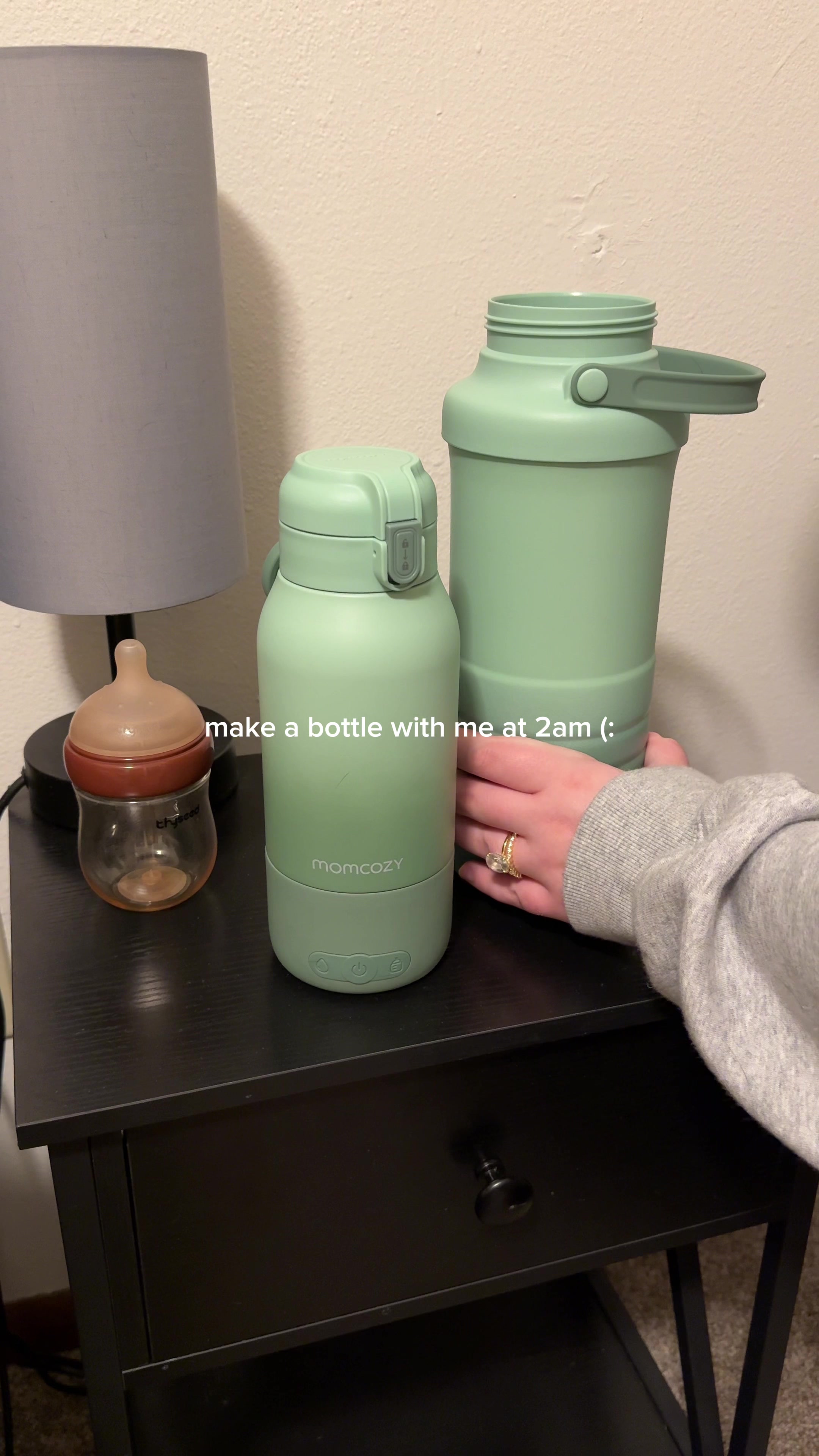 TikTok post by @simplysunshineblog for Momcozy. Caption reads: make a bottle with me at 2am! Momcozy portable....