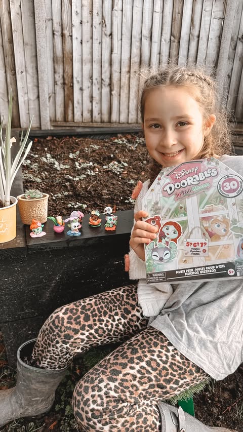 Instagram post by an influencer for Disney Doorables. Caption reads: Disney Doorables In Full Bloom 💐 Ad | [...].