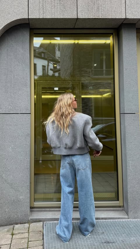 Instagram post by @mandisfashionworld for AGOLDE. Caption reads: Quiet outfit, loud energy 🩶 @agolde *advertising....