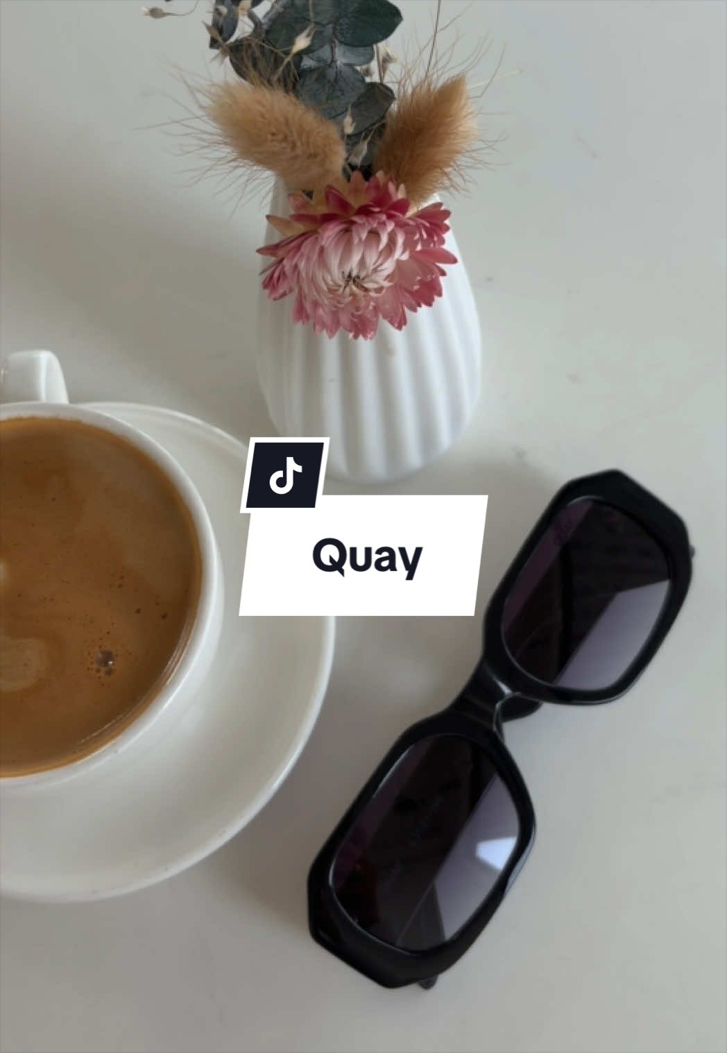 TikTok post by @trishugccreator for QUAY. Caption reads: Coffee + Hyped Up @Quay.
