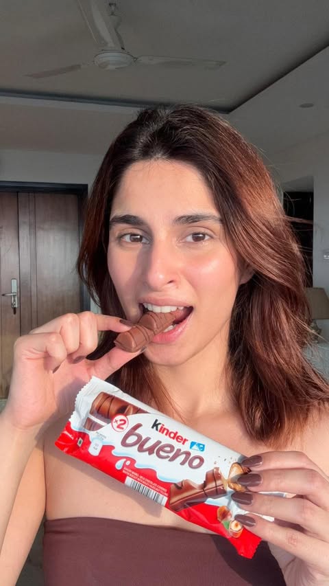 Instagram post by @aisharahmed for Kinder. Caption reads: [...] moments of pleasure, only with Kinder Bueno!....