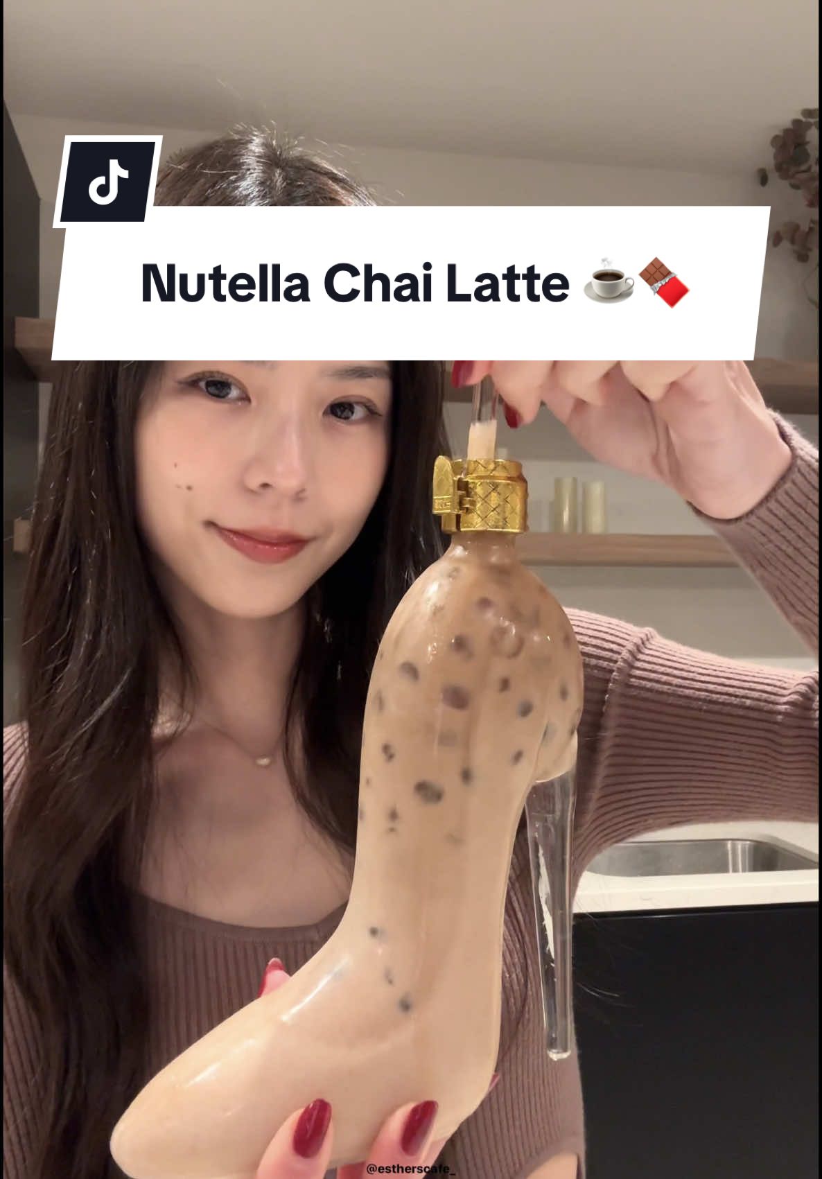 TikTok post by @estherscafe for Tazo. Caption reads: IG: estherscafe_ | 👸 nutella + milk of choice &....