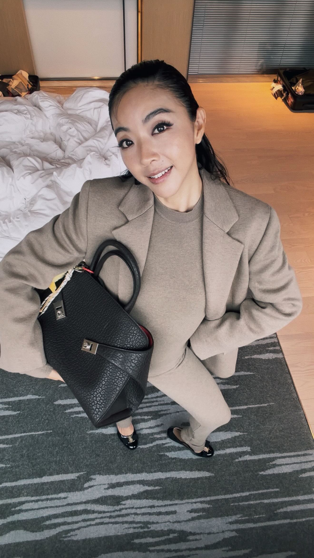 Instagram post by @yuyuzhangzou for FERRAGAMO. Caption reads: GRWM for @ferragamo new flagship store opening in....