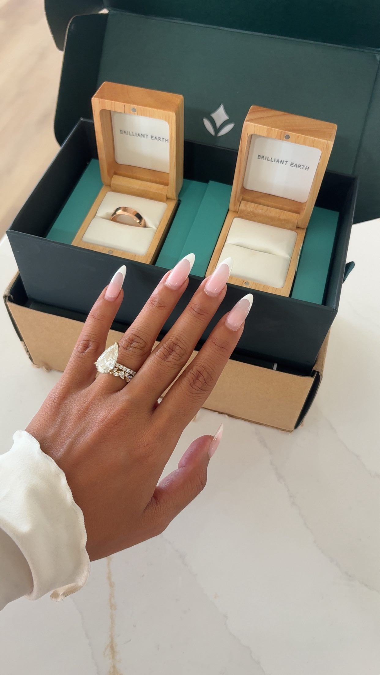 Instagram post by @adelainemorin for Brilliant Earth. Caption reads: My dream stack 💍🤍 So happy with the final rings....