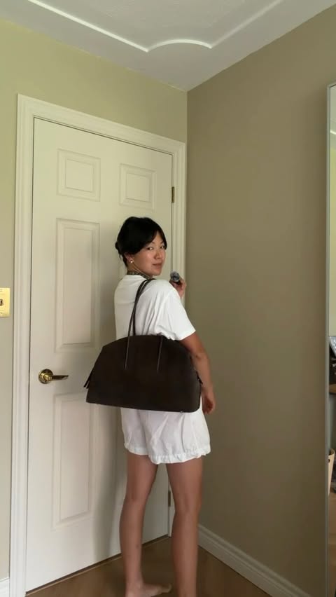 Instagram post by @jessundecided for DeMellier. Caption reads: New bag energy @demellierlondon * gifted.