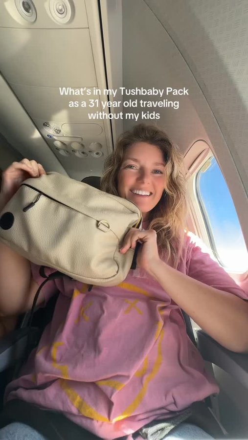 Instagram post by @whereisbriggs for Tushbaby. Caption reads: Code TOURIST15 will get you $11 off the @tushbaby....