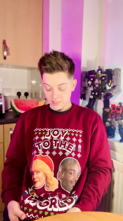 Instagram post by @christeldeeofficial for Doctor Who. Caption reads: Thanks @bbcdoctorwho for this lovely jumper! I....