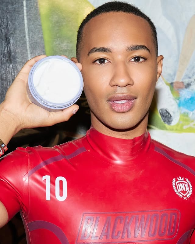 Instagram post by @blkwd1017 for Brandon Blackwood. Caption reads: Holiday parties: statement bag, perfect skin.....