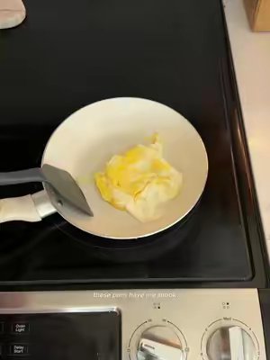 TikTok post by @irl_tay for T-fal USA. Caption reads: [...] #cookingtok #pans #20something @tfalusa.