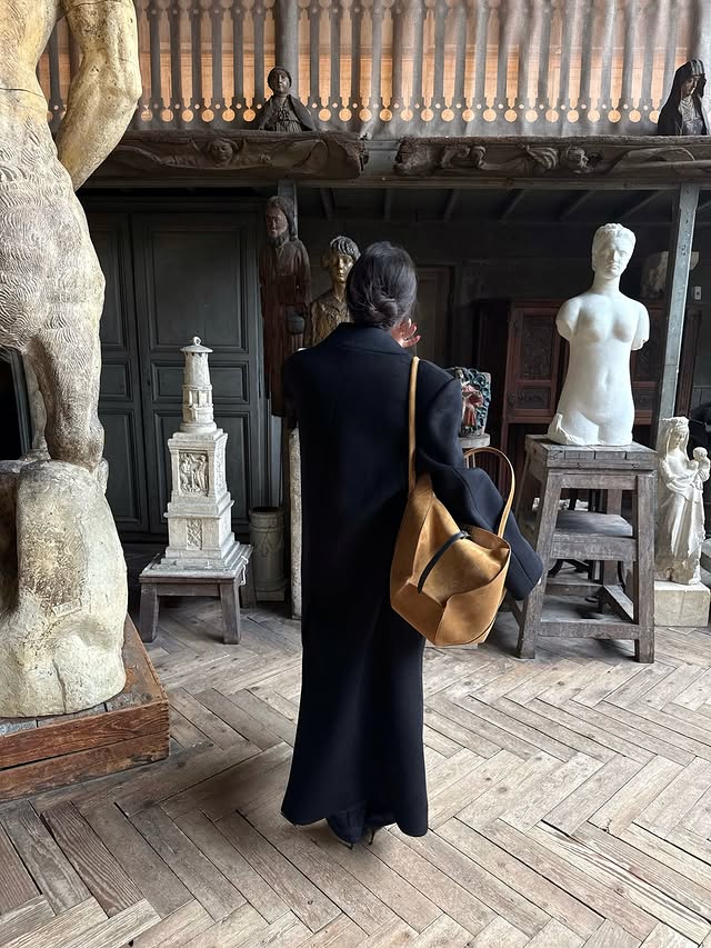 Instagram post by @elie.rtl for NINA RICCI. Caption reads: the intimacy of a solo date @ninaricci *ad.