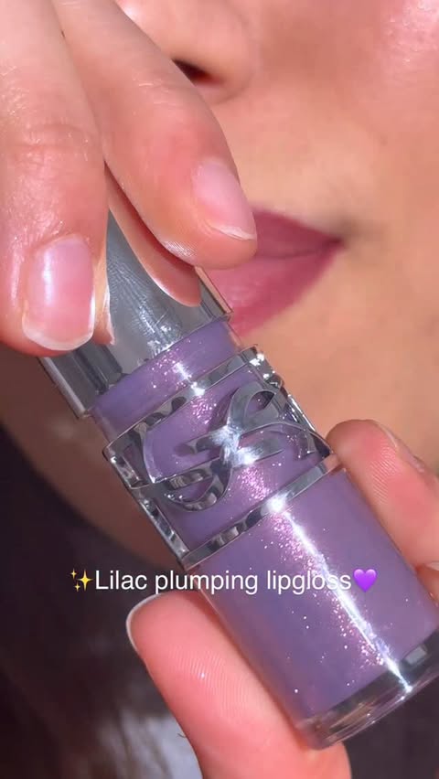 Instagram post by @marinanalha for LAWLESS Beauty. Caption reads: Always here for a lilac moment 💜 Ysl lip plumping....