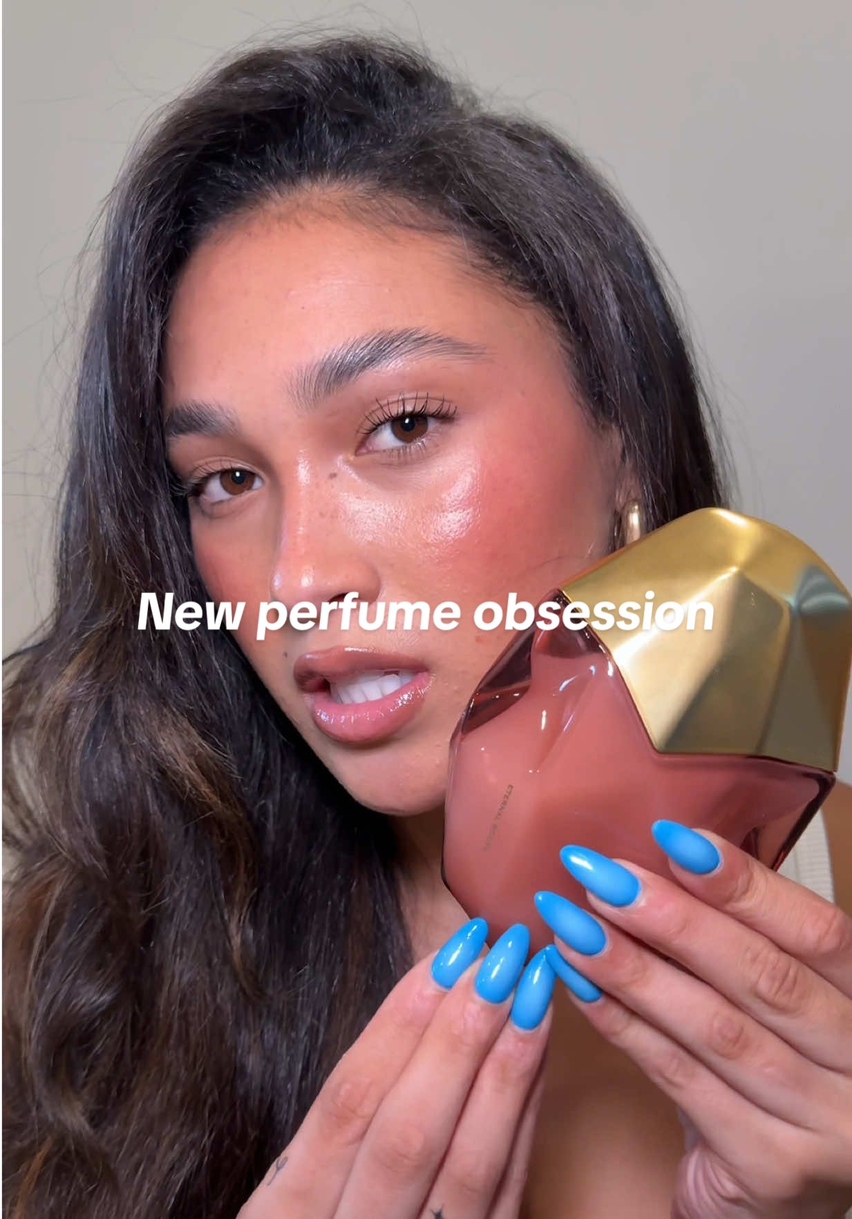 TikTok post by @autumnthompkins for Orebella. Caption reads: my new perfume obsession @'Ôrəbella ETERNAL ROOTS....