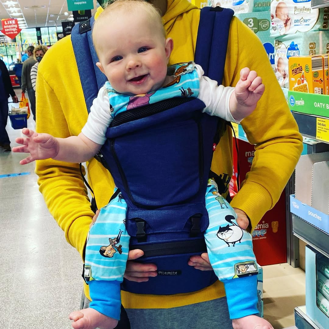 Instagram post by @life_with_teddyjohn for MiaMily. Caption reads: #ad #gifted @miamilybabycarriers making shopping....