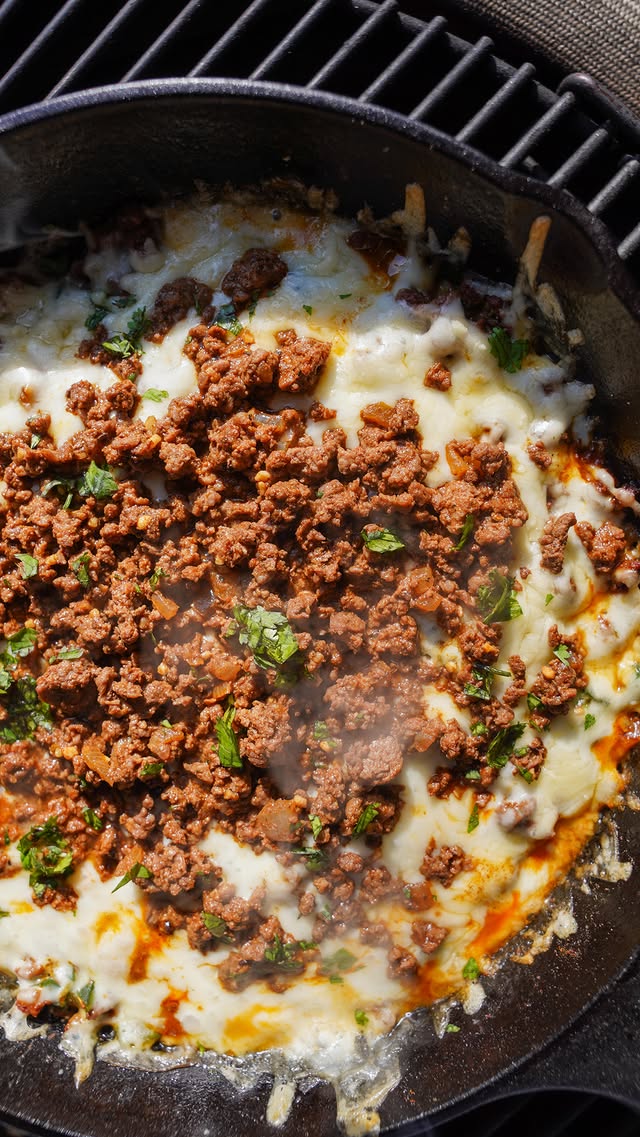 Instagram post by @jenniferdanella for Kamado Joe. Caption reads: [...] Fundido cooked to perfection on my....