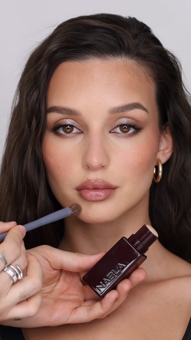 Instagram post by @hindash for NABLA Cosmetics. Caption reads: THE ART OF SKIN ✨ featuring a full face of....