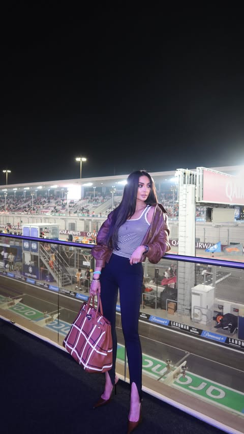 Instagram post by @nour for Visit Qatar. Caption reads: Speed, lights, and Doha magic ✨🏎
#AD @VisitQatar....