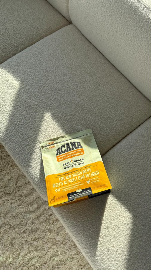 Instagram post by @natdoumkos for ACANA Petfoods. Caption reads: #Ad Coyo has been obsessed with the ACANA Freeze....