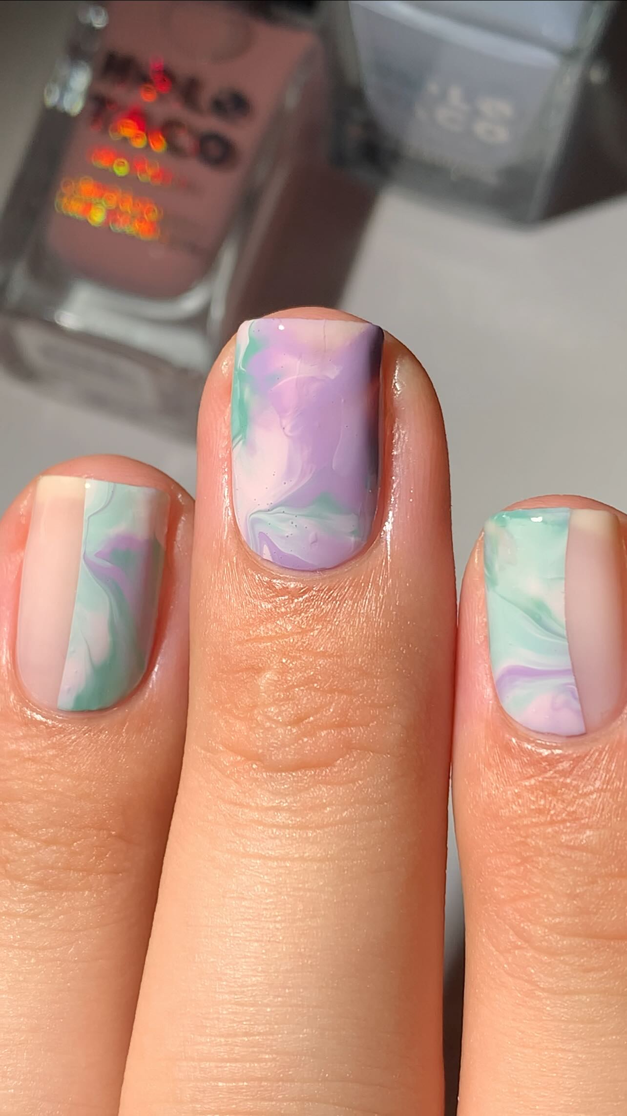 Instagram post by @abe.nailbabe for Holo Taco. Caption reads: Would you wear this?💜🩵

Smoosh marble. But....