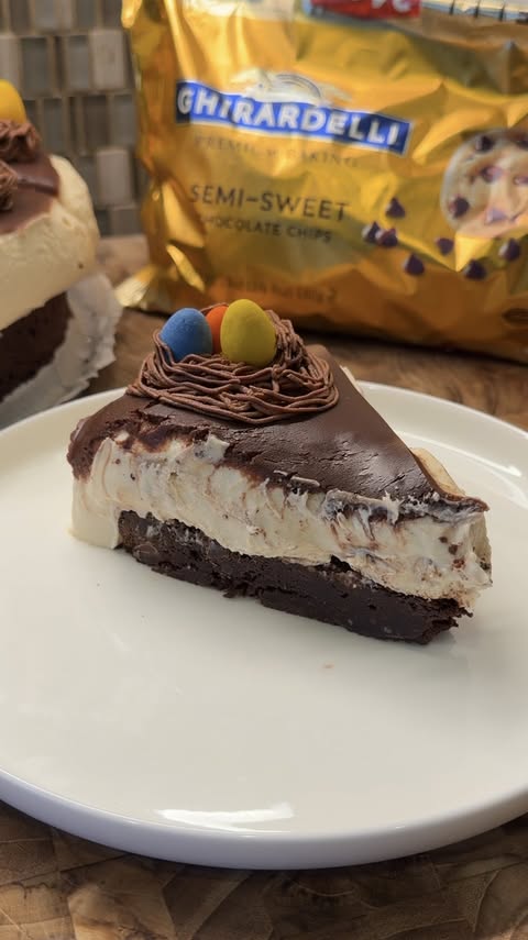 Instagram post by @erinscozykitchen for Ghirardelli Chocolate Company. Caption reads: brownie peanut butter cheesecake 🍫 to bring to....