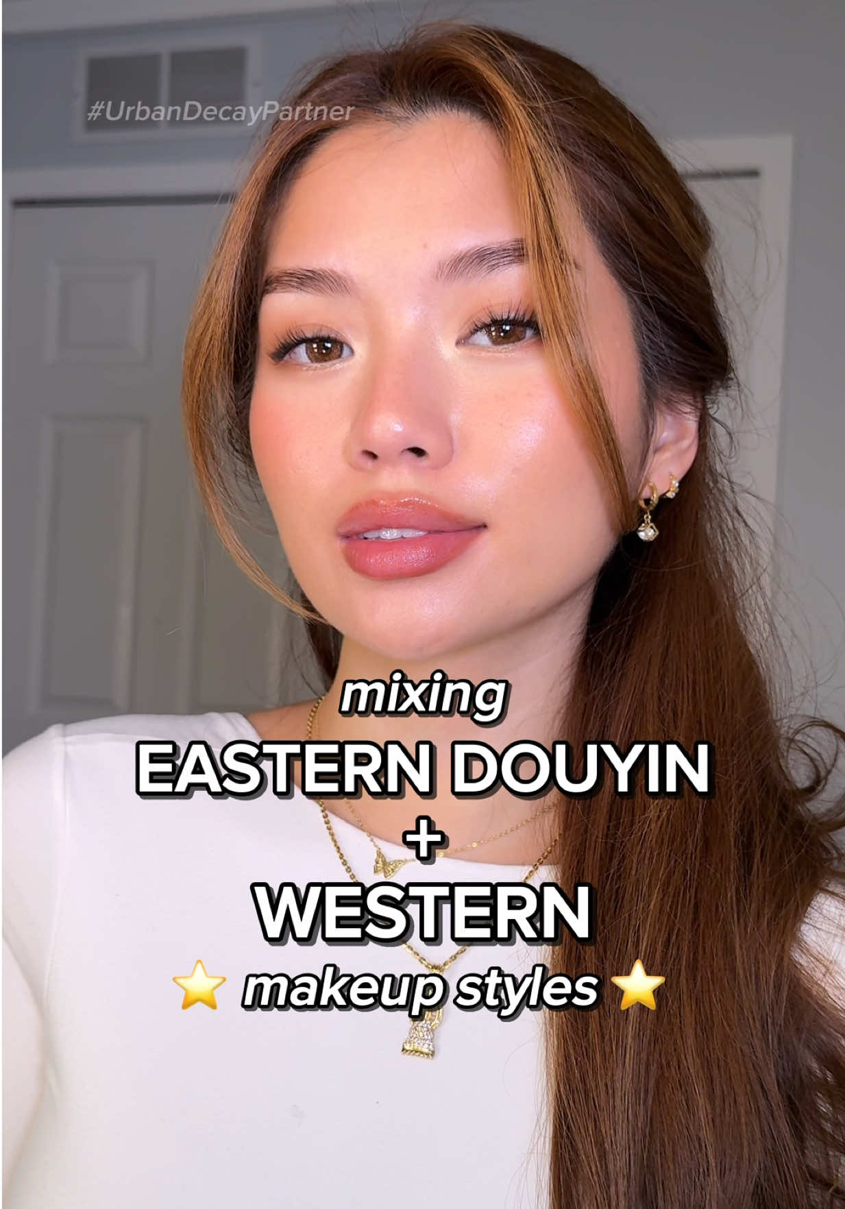 TikTok post by @asianndra for Urban Decay. Caption reads: EASTERN DOUYIN x WESTERN MAKEUP STYLE ⭐️✨ do we....