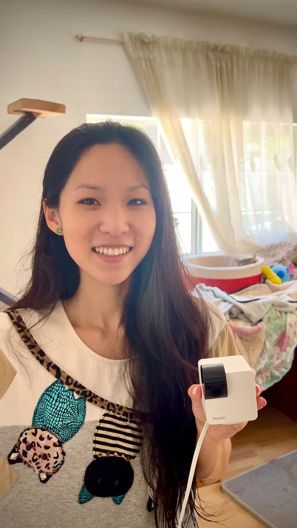 Instagram post by @ericaychan for Petcube. Caption reads: [...] when you’re not home! 🐈‍⬛ 🐈🐱 The @petcube....