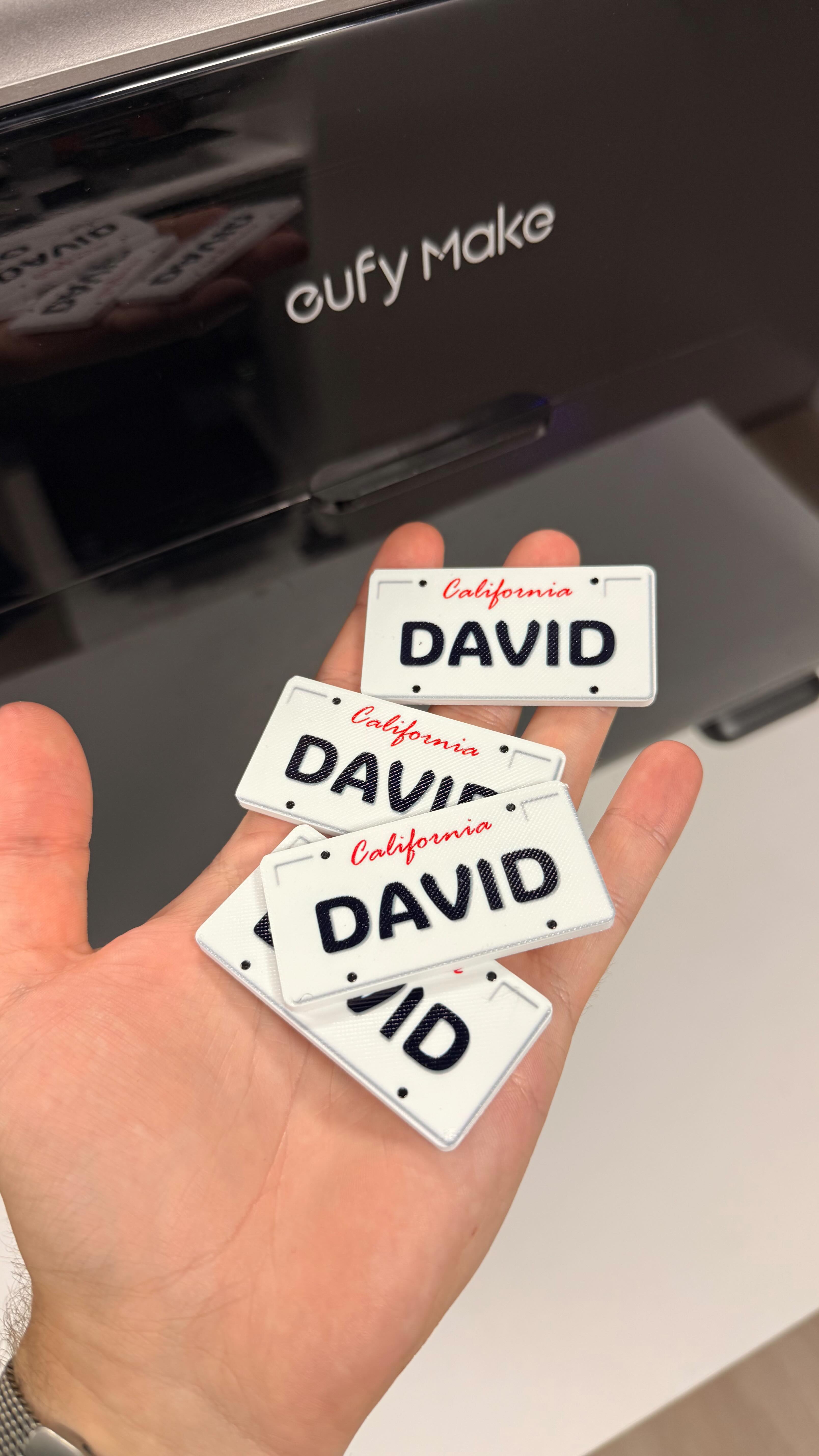 Instagram post by @davidkrammer for AnkerMake. Caption reads: I made MINI Licence Plates! 😂 #eufyMake....