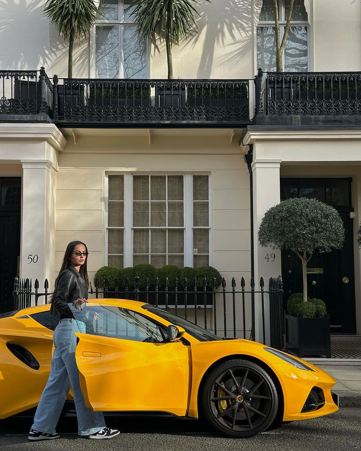 Instagram post by an influencer for Lotus Cars. Caption reads: Sunshine in car form 💛🌞✨ @lotuscars #LotusEmira....