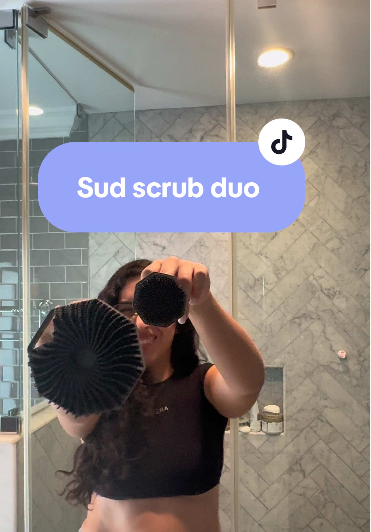 TikTok post by @nikkid383 for Sud Scrub. Caption reads: [...] purchase! You need this shower upgrade @Sud....