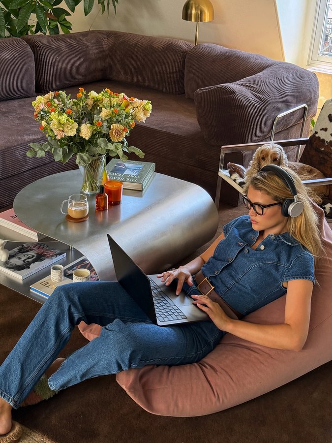 Instagram post by @chloelecareux for Moschino. Caption reads: My favorite place to recharge my social battery 🔋....