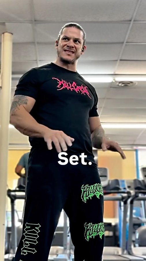 Instagram post by @legendary_pasos for FLEX Magazine. Caption reads: One hand on the bell the other on the floor....