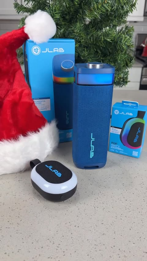 Instagram post by @watchyourhaircut for JLab. Caption reads: Make Your Holidays Epic with JLAB 🎁 @jlabaudio....