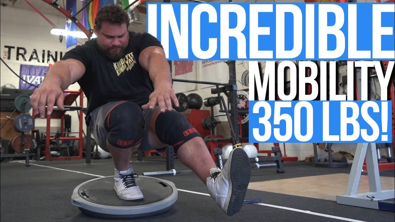 YouTube post by @MartinsLicis for Kinda Fit Kinda Fat. Caption reads: Martins Licis Shows  Squat Routine After Strongman....