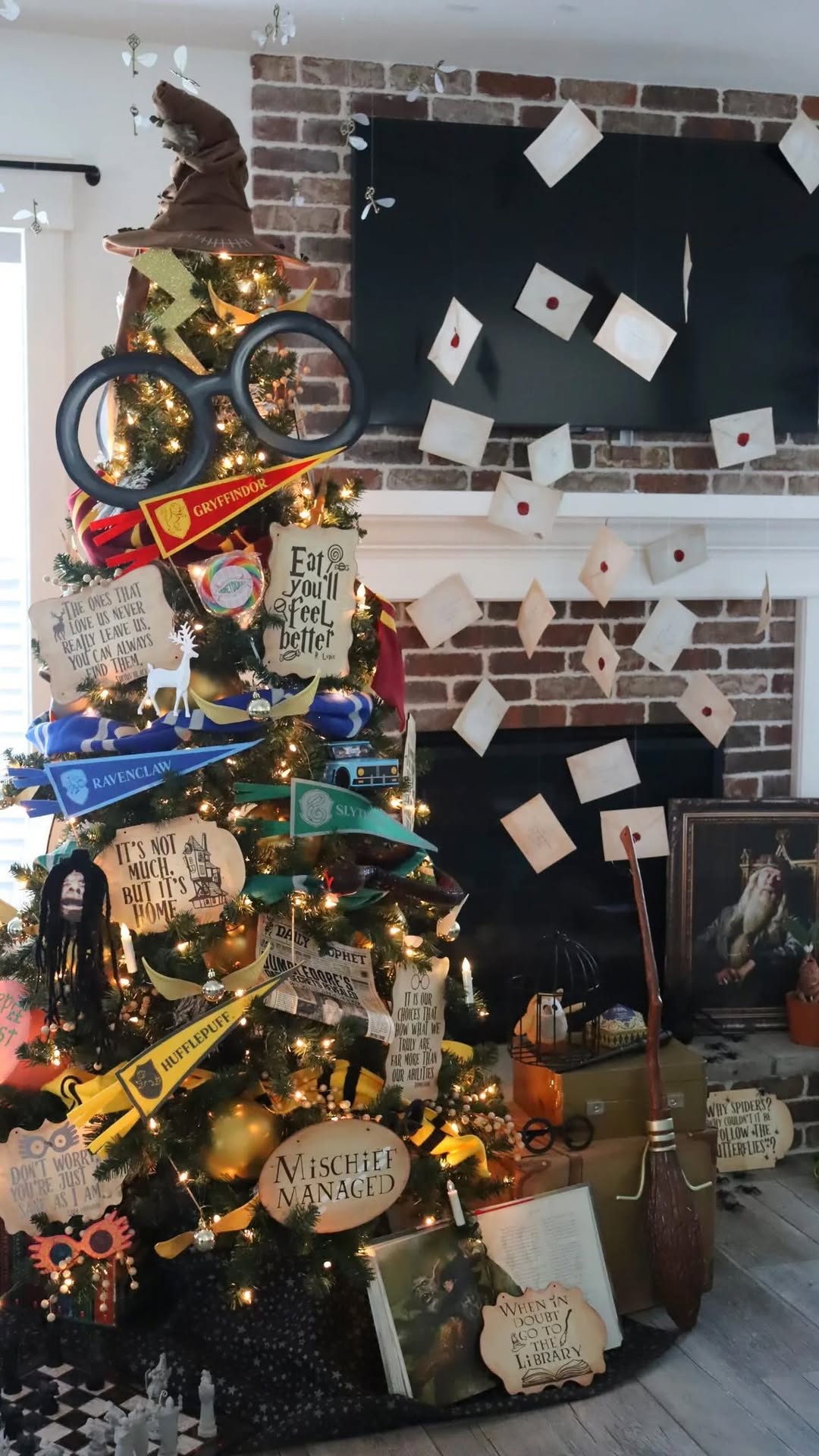Instagram post by @agirlandagluegun for Oriental Trading. Caption reads: My themed Christmas tree for 2023 is up! I can’t....