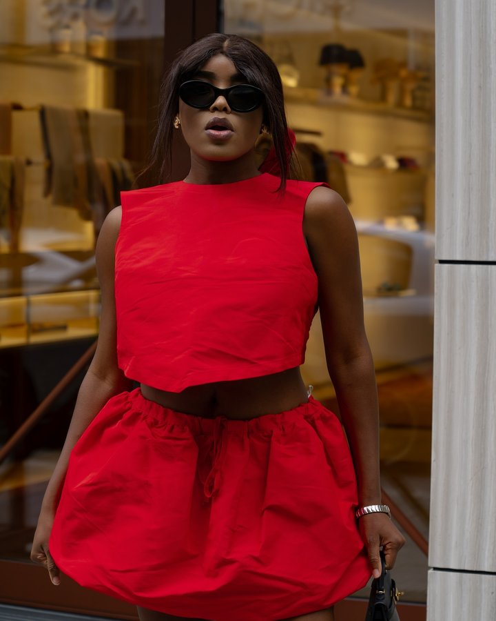 Instagram post by @dizeudaniele for PATOU. Caption reads: Anzeige// summer in the city 🌹🌹 @patou.